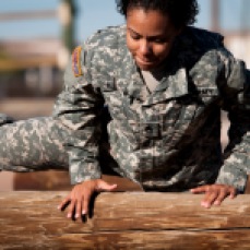 Staff Sgt. Lesley Hill stationed at Fort Campbell, Ky. runs through the obstacle course along with fellow Operational Contract Support Joint Exercise 2016 participants during OCSJX-16, March 24, 2016, at Fort Bliss, Texas. This exercise provides training across the spectrum of OCS readiness from requirements and development of warfighter staff integration and synchronization through contract execution supporting the joint force commander. (U.S. Air Force photo by Tech. Sgt. Manuel J.Martinez/Released)