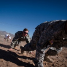 Staff Sgt. Reginald Alexander and Maj. Jonathan Gardner traverse an obstacle course with fellow Operational Contract Support Joint Exercise 2016 participants during OCSJX-16, March 24, 2016, at Fort Bliss, Texas. This exercise provides training across the spectrum of OCS readiness from requirements and development of warfighter staff integration and synchronization through contract execution supporting the joint force commander. Sgt. Alexander and Maj. Gardner are stationed at Fort Hood, Texas. (U.S. Air Force photo by Tech. Sgt. Manuel J.Martinez/Released)