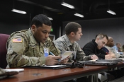 1st Lt. Keita Rodgers, 1st Special Forces Group (Airborne) service platoon leader, Joint Base Lewis McCord, Washington, reviews the Operational Contract Support 101 training material, March 13, 2017, at Fort Bliss, Texas. OCSJX-17 provides training across the spectrum of OCS readiness from requirements and development of warfighter staff integration and synchronization through contract execution supporting the joint force commander. (U.S. Air Force Photo by Tech. Sgt. Chad Chisholm/Released)